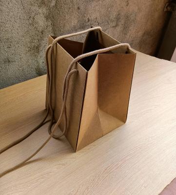 China Custom Recyclable Paper Recyclable Waterproof Trapezoidal Paper Packaging Carry Bag For Fresh Flower Shop for sale