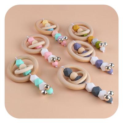 China Soft Wooden Silicone Teether Baby Ring Baby Gift Set Food Grade Toys Silicon Teething Mitten Toy Ring Custom Rattle WoodenTeething for sale