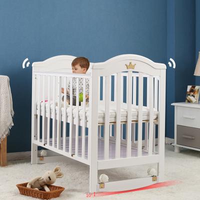 China Modern Cribs Baby Cribs Multifunctional Solid Wood Newborn Crib Newborn Cribs 0-3 Years Old Baby Cribs With Rollers for sale