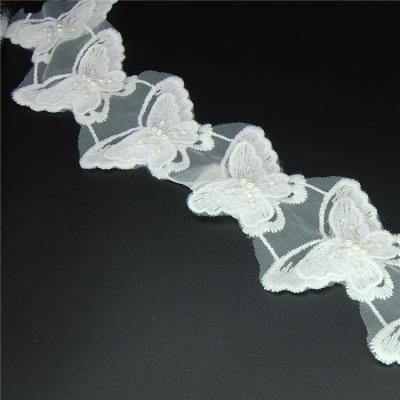 China Sustainable Wholesale Guangzhou Butterfly Pearl White Double Sided Tulle Fabric Lace Trims for sale