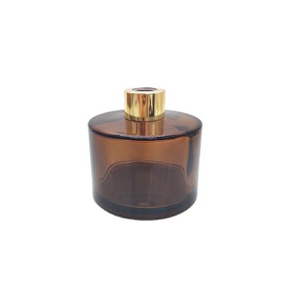 China Gift & High Quality Cylinder Craft 200 Ml Glass Bottle Amber Diffuser With Gold Cap for sale