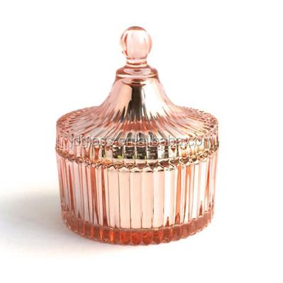 China Viable wholesale luxury embossed glass jar with lids for sale