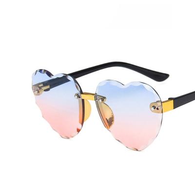 China New Fashion Sunglasses Heart Rimless Kids Sunglasses Shape Children Heart Shape Glass Girls Sun Eyewear Outdoor Travel UV400 Protection for sale