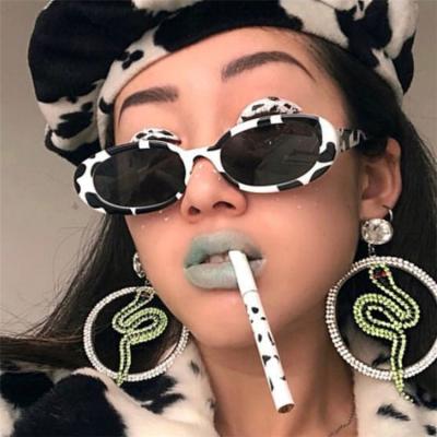 China Designer Retro Cow Print Sun Glass Oval Ladies Trendy Shading 2021 Luxury Vintage Small Oval Sunglasses For Women for sale