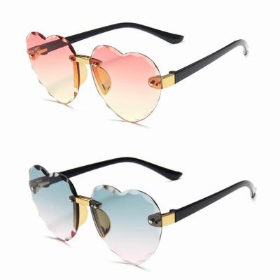 China Heart Kids Heart Sunglasses Cute Kids Shades 2021 Fashion Rimless Baby Love Shape Little Girls Sun Glasses for sale