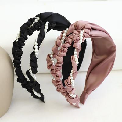 China Fashion Wholesale Korean Fashion Women Girls Hair Accessories Custom Fabric Hollow Knot Pearl Headband for sale