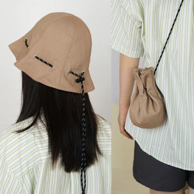 China Singular Drawstring Fisherman Solid Color Sunscreen Foldable Messenger Bag Basin Hat Straight Storage Hat for Men and Women for sale