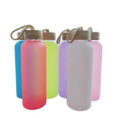 China Sustainable Wholesale Hot Sale Sublimation 20oz Mixed Color Coffee Soda Shaped Beer Sublimation Glass Water Bottle With Bamboo Lid Top for sale