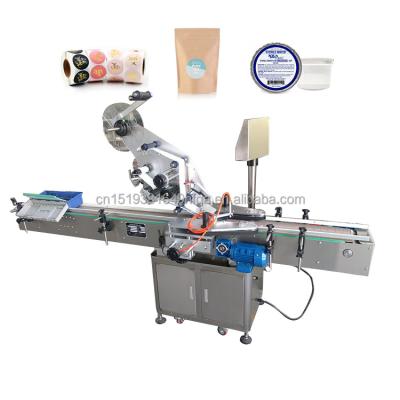 China Food Use Universal Hot Selling Automatic Box Labeling Machine Cans Multifunctional Handy Labeling Machine Automatic Flat Surface Top Labeler for sale