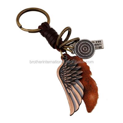 China Leather and alloy key chain punk leather wings alloy pendants men cool genuine leather key chain for sale