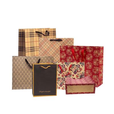 China Custom Reusable Retail Luxury Boutique China Manufacture Gift Shopping Paper Bags Recyclable Logo Printed Cardboard Paper Bag With Handle for sale