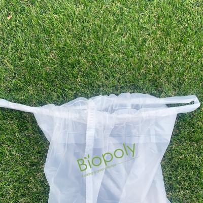 China Biopoly Compostable Bag 100% Biodegradable Clean Kitchen Waste Tearproof Drawstring Bag On Roll for sale