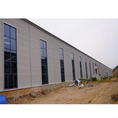 中国 Modern Industrial Mild Steel Construction Low Cost Steel Structure Warehouse Building Designs 販売のため