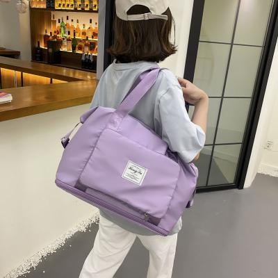 China Durable Fashion Sports Gym Bags Folding Travel Bags Simple Pure Color Shoulder Bag Tote For Men Women for sale