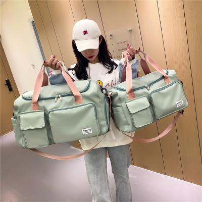 China Durable Causal Sports Gym Travelling Bags Dry Wet Separation Tote Duffle Bags Woman Waterproof Large Capacity Luggage Storage Bag for sale