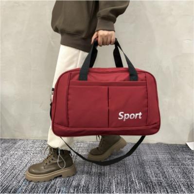 China Durable Outdoor Sports Travel Duffle Bags Unisex Waterproof Tote Luggage Bag High Capacity Travelling Crossbody Bag for sale