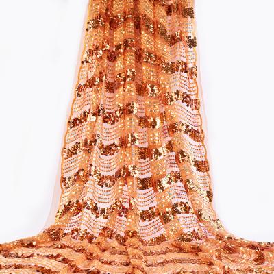 China Other Luxury 130cm Orange Color Wave Design Embroidery Sequin Lace Up Fabric For Wedding Garment for sale