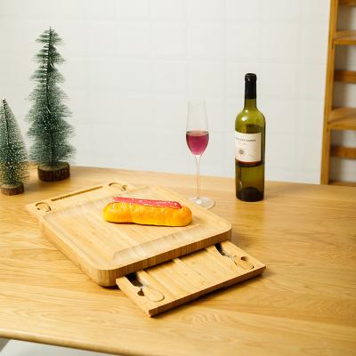 China Sustainable Wholesales Cheese Boards Cheese Cutting Board Set Charcuterie Bamboo Wooden Cheese Board Set With Drawers for sale