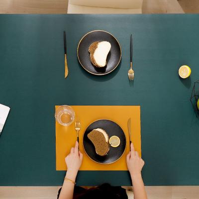 China Fathionable Sustainable Heat Resistance Environmentally Friendly Anti Slip Luxury Kitchen Dining Double Sided Leather Table Mats for sale