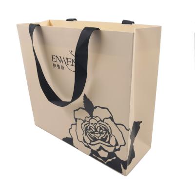 China Recyclable The Art Of The Key Buying Custom Logo Paper White Paper Bag Branded Packaging Art for sale