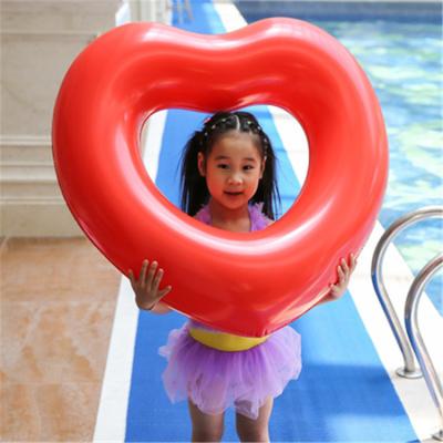 China New Fashionable Popular Custom Transparent Tube Baby Heart Inflatable Pool Float Swimming Ring for sale