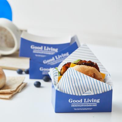 China Recyclable Wholesale Sandwich Toast Shop Burger Breakfast Hand Holding Blue Paper Box for sale