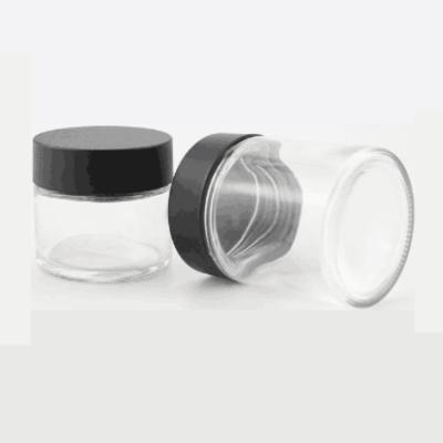 China Cosmetic in 60ml face cream stock empty glass jar round clear glass skin care child safe jars jar with lid black white for sale