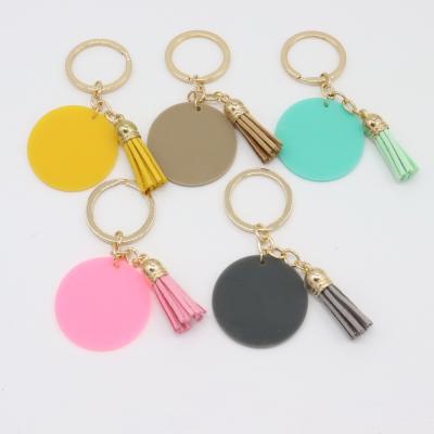 China New Arrival Monogram Colored White Acrylic Key Chain Round Clear Plastic Key Ring With Suede Tassle for sale