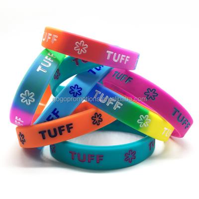 China Cheap Rubber Wristbands Silicone Printed Motivational Wristbands Debossed Wristbands for sale