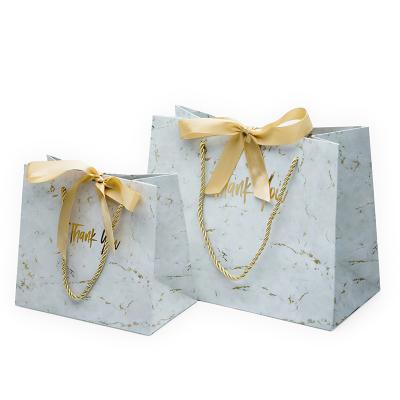 China Handmade custom logo paper bag with bow tie ribbon, paper bag with ribbon closure, paper bag with rope handle for sale