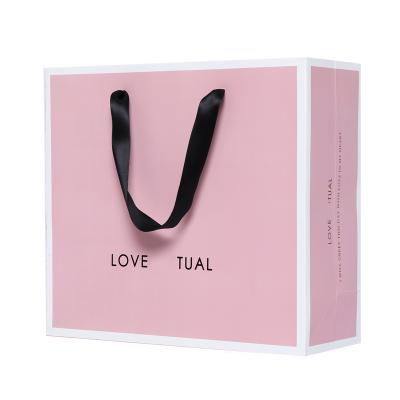 China High quality recycled materials custom shopping paper bag with your logo, printing paper bag with black handles for sale