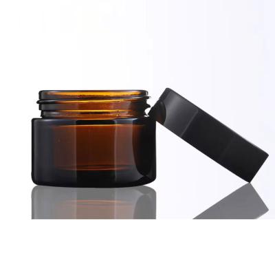 China Cosmetic 5ml, 10ml, 15ml, 20ml, 30ml 50ml 100ml amber glass cream jar with black cap for cosmetic cream stocks for sale