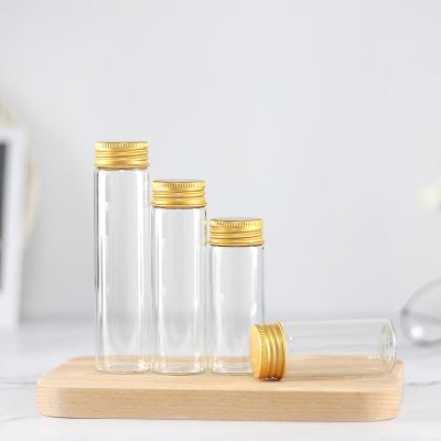 China Gift & Craft 37mm Borosilicate Glass Tube Type Bottle With Gold Silver Metal Cap Candy Jar for sale