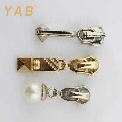 China Yab Latest Fashion Wholesale Price Nickel Free Decorative Metal Zipper Puller For Various Zipper Slider for sale