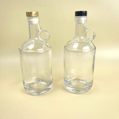 China Lurury 750ml Clear Glass Heavy Bottom Round Handleware Liquor Jug - 21.5mm Neck Top Finish Bar for sale