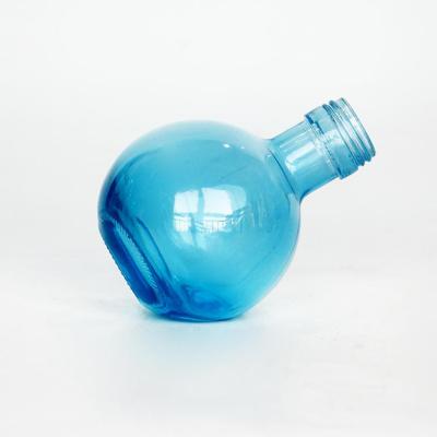 China Food Grade Newly To Design Blue Color Sprayed Unique Custom Shape Round Glass Bottle For Beverage for sale