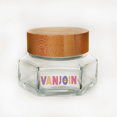 China 30ml 50ml 100ml high grade hexagon shape mini face cream cosmetic glass jar with wooden bamboo lid for sale