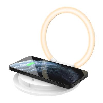 China Creative Qi Factory Wireless Charger Three Speeds LED Night Lights Phone Holder Folding Portable Bedside Lamp for sale