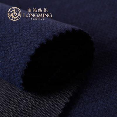 China Cheap price pure dark blue polyester rayon stretch anti-static brushed knit flannel fleece fabric for coat for sale