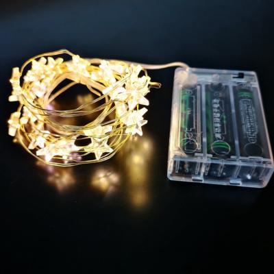 China Garland light Hot Sale Battery Powered Fairy Star Lights LED Star Copper Wire Light Party Holiday Home Decoration Light for sale