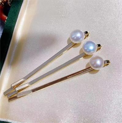 China Designer Hair Accessories 2023 New Wholesale Stock New Designs Big Korean Statistical Fashion Hair Pins Pearl Hair Clips for sale