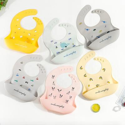 China 2022 New Style Silicone Washable Detachable Waterproof Bibs For Baby PU Disposable Feeding Bibs With Pocket To Catch Food for sale