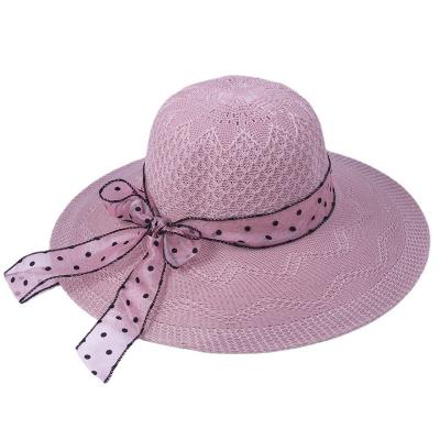 China Female Travel Seaside Large Dobby Beach Straw Hat Summer Sunscreen Brim Vacation Bow Tie Sun Hat for sale