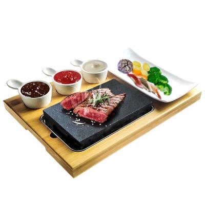 China Viable Cooking Indoor BBQ Table Grill Lava Hot Steak Stone Plate Complete Stone Set Hibachi Grilling Stone for sale