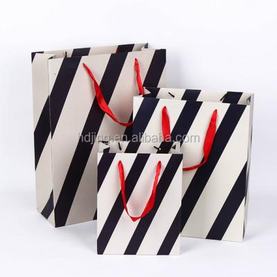 China Wholesale Recyclable Stripe Paper Handbag Color Printing Paper Bag A4 Size (H-098) for sale