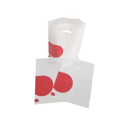 China Durable Eco Friendly Recyclable Plastic T Shirt Bags With Flat Perforated Handles for sale