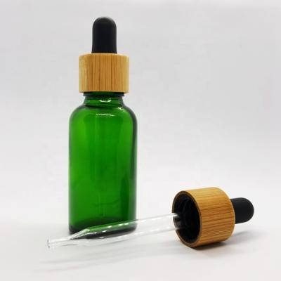 China 30ml Essential Oil Essential Oil Green Glass Bottles With 18mm Dropper Glass Cap Bamboo Cover for sale