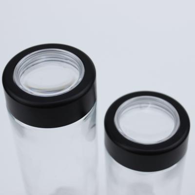 China Personal Care Display Glass Jar With Child Resistant Cap Magnify Effect Storage Jar CR Glass Lid Packaging Material Magnify Lid for sale