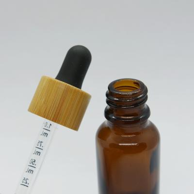 China 30ml 1oz Bamboo Essential Oil Cap Cosmetic Bamboo Black Matte Frosted Glass Dropper Bottle With Essential Oil Bottles for sale