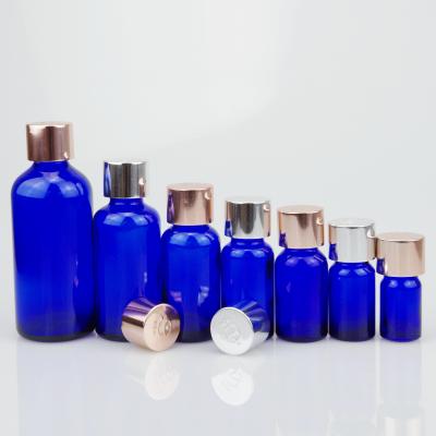 China 18/415 cosmetic aluminum screw cap for 5ml 10ml 15ml 20ml 30ml 50ml essential oil blue glass bottle for sale